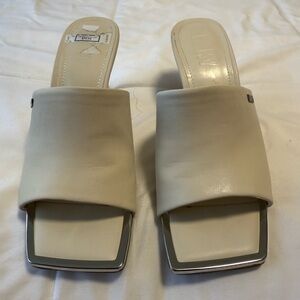 NWOB-DKNY -squared toe, ivory, Slide Sandals with Silver Accents, 3” heel. 5.5